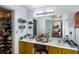 Bathroom featuring double sinks, a large mirror, and a walk-in closet at 949 Tumlin Trce, Lawrenceville, GA 30045