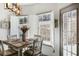 Dining area with shutters and an exit door, adjacent to the living room at 949 Tumlin Trce, Lawrenceville, GA 30045