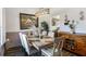 Formal dining room with elegant decor, lighting fixture, and wood accents at 949 Tumlin Trce, Lawrenceville, GA 30045