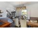 Bright dining area with a stylish light fixture and a glimpse of the staircase at 949 Tumlin Trce, Lawrenceville, GA 30045