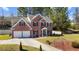 Traditional two-story brick home with a two-car garage and well-manicured lawn at 949 Tumlin Trce, Lawrenceville, GA 30045