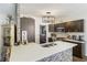 Stylish kitchen with gray cabinets, quartz countertops, and stainless steel appliances at 949 Tumlin Trce, Lawrenceville, GA 30045