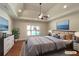 Spacious bedroom featuring a ceiling fan, a large window, and recessed lighting at 129 Elite Way, Mcdonough, GA 30252