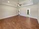 Spacious main bedroom featuring hardwood floors and tray ceiling at 129 Elite Way, Mcdonough, GA 30252