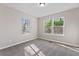 Cozy bedroom featuring neutral walls, large windows, and plush carpeting at 19 Grove Park Nw Pl, Atlanta, GA 30318