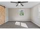 Bedroom featuring neutral walls, a ceiling fan, and gray carpeting throughout at 19 Grove Park Nw Pl, Atlanta, GA 30318