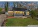 Charming home with a screened-in porch and landscaped front yard at 19 Grove Park Nw Pl, Atlanta, GA 30318
