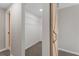 Walk-in closet featuring wire shelving, neutral walls, and a sliding barn door at 19 Grove Park Nw Pl, Atlanta, GA 30318