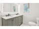 Bathroom featuring a double sink vanity, modern fixtures, and white walls at 2910 3Rd Sw Ave, Atlanta, GA 30315