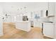 Modern kitchen with white cabinetry, stainless steel appliances, and marble countertops at 2910 3Rd Sw Ave, Atlanta, GA 30315