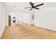 Open-concept kitchen and living area featuring hardwood floors, neutral paint, and modern lighting at 2910 3Rd Sw Ave, Atlanta, GA 30315