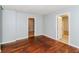 Bright living room with hardwood floors, neutral paint, and multiple doorways, offering a cozy atmosphere at 491 Bolton Nw Rd, Atlanta, GA 30331