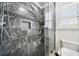 Modern bathroom features a spacious walk-in shower with gray marble tiling and a built-in niche at 931 New Bedford, Marietta, GA 30068