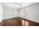 Well-lit bedroom featuring hardwood floors, fresh paint, a ceiling fan and a window at 931 New Bedford, Marietta, GA 30068