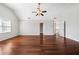 Large bedroom with hardwood floors, vaulted ceiling, ceiling fan, and natural light from large windows at 931 New Bedford, Marietta, GA 30068