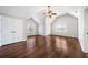 A spacious bedroom featuring beautiful hardwood floors, a ceiling fan, and plenty of natural light at 931 New Bedford, Marietta, GA 30068