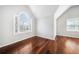 Bright bedroom featuring hardwood floors, vaulted ceiling, and natural light from a large arched window at 931 New Bedford, Marietta, GA 30068