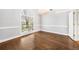 Elegant dining room showcasing hardwood floors, chandelier, and large picture window at 931 New Bedford, Marietta, GA 30068