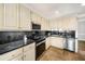 Lovely kitchen featuring stainless steel appliances, granite counters and ample counter space at 931 New Bedford, Marietta, GA 30068