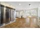 Open kitchen space featuring stainless steel refrigerator and connection to living area at 931 New Bedford, Marietta, GA 30068