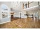 Open-concept living space with tile floors, fireplace, and chandelier at 931 New Bedford, Marietta, GA 30068