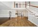 Open living space with tile floors, staircase, and view of the kitchen at 931 New Bedford, Marietta, GA 30068