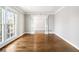 Light-filled living room with hardwood floors, decorative trim and large picture window at 931 New Bedford, Marietta, GA 30068