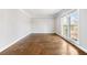 Bright living room showcasing hardwood floors and a large window for natural light at 931 New Bedford, Marietta, GA 30068