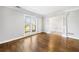 Spacious living room featuring hardwood floors, decorative trim and open doorway at 931 New Bedford, Marietta, GA 30068