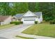 Charming single-story home with a two-car garage, manicured lawn, and mature trees at 4036 Mcpherson Dr, Acworth, GA 30101