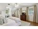 Comfortable bedroom with a ceiling fan, large windows, and hardwood floors at 435 Collier Nw Rd, Atlanta, GA 30309