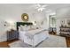 Bright bedroom featuring a luxurious bed, stylish decor, and hardwood floors at 435 Collier Nw Rd, Atlanta, GA 30309