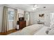 Bright bedroom featuring large windows and a decorative antique dresser at 435 Collier Nw Rd, Atlanta, GA 30309