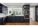 Stylish kitchen featuring modern appliances, dark cabinets, and lots of natural light at 435 Collier Nw Rd, Atlanta, GA 30309