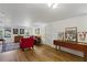 Spacious living room featuring hardwood floors, multiple windows and stylish furnishings at 435 Collier Nw Rd, Atlanta, GA 30309