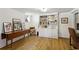 Open living room featuring a large bookcase, hardwood floors and natural light at 435 Collier Nw Rd, Atlanta, GA 30309