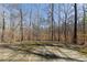 The home has a big backyard backing to mature trees, perfect for privacy and outdoor living at 5060 Governors Walk Dr, Canton, GA 30115