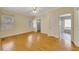 Sun-drenched bedroom with hardwood floors and neutral color scheme, with ensuite bathroom access at 5060 Governors Walk Dr, Canton, GA 30115