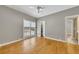 Bedroom featuring hardwood floors and an ensuite bathroom and a walk-in closet at 5060 Governors Walk Dr, Canton, GA 30115