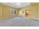 Large bonus room featuring neutral paint, new carpet, and ample space for recreation or relaxation at 5060 Governors Walk Dr, Canton, GA 30115