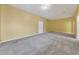 Large bonus room features neutral paint, new carpet, and ample space for recreation or relaxation at 5060 Governors Walk Dr, Canton, GA 30115