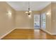 View of the dining room with wood floors and plenty of natural light at 5060 Governors Walk Dr, Canton, GA 30115