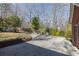 Long driveway leading to the red brick home surrounded by trees and lush landscaping at 5060 Governors Walk Dr, Canton, GA 30115