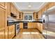 Spacious kitchen featuring granite countertops, stainless steel appliances, and wood cabinetry at 5060 Governors Walk Dr, Canton, GA 30115