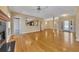 Open-concept living room featuring hardwood floors and an opening to the kitchen at 5060 Governors Walk Dr, Canton, GA 30115