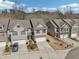 An aerial view of the homes with well-manicured lawns, driveways and attached garages at 5890 Vinyard Ln, Cumming, GA 30041