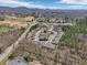 This aerial shot captures a lovely property nestled among trees, highlighting its prime location, community pool, and well-kept grounds at 5890 Vinyard Ln, Cumming, GA 30041