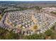 Expansive aerial view of a neighborhood with tree-lined streets and well-spaced homes at 946 Gardenia Curv, Canton, GA 30114