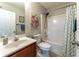 Bathroom with a shower-tub combo, vanity, and a decorative shower curtain at 946 Gardenia Curv, Canton, GA 30114