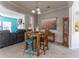 Cozy dining area with rustic wooden table and adjacent living room, creating an inviting space at 946 Gardenia Curv, Canton, GA 30114